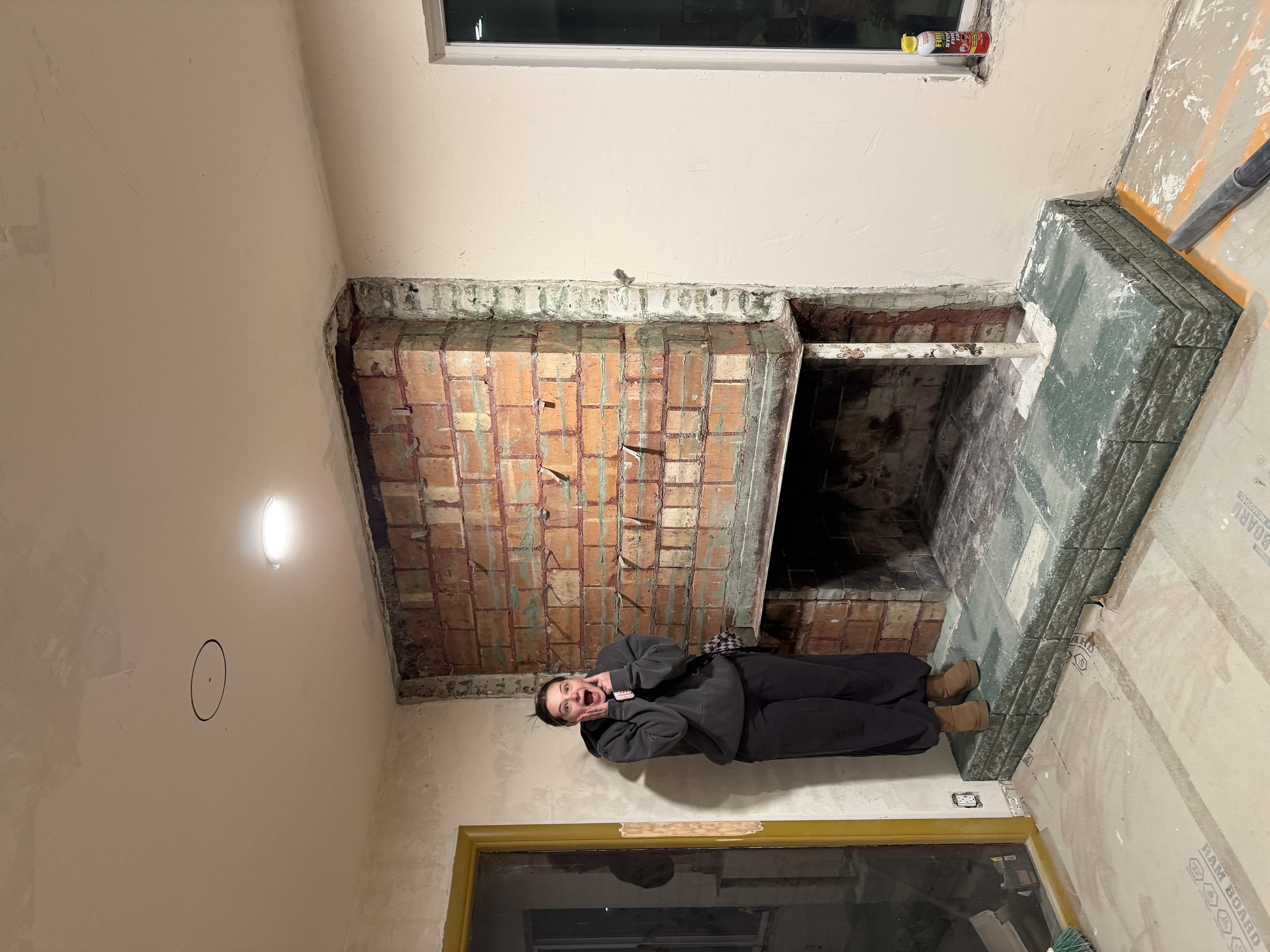 Emma excited about exposed brick fireplace